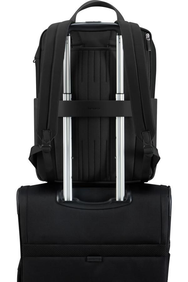Backpack that fits over suitcase handle clearance