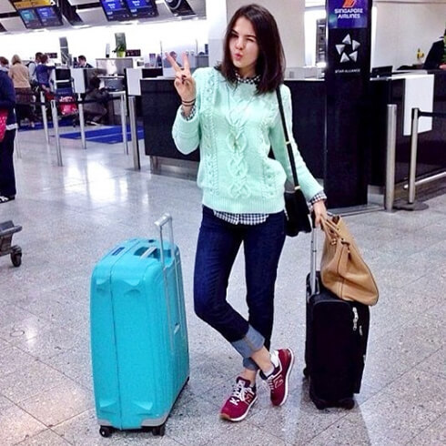 Priscila Betancort waiting for her flight with her Yellow S'Cure...